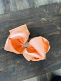 Coral hair bow